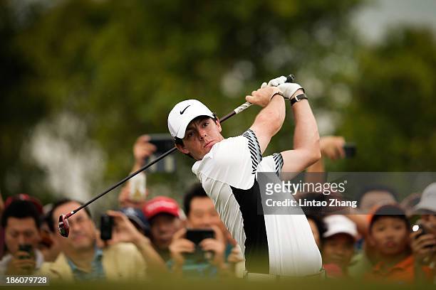 Rory McIlroy of Northern Ireland hits a shot on the seventh hole during the match against Tiger Woods of the United States at Blackstone Course...