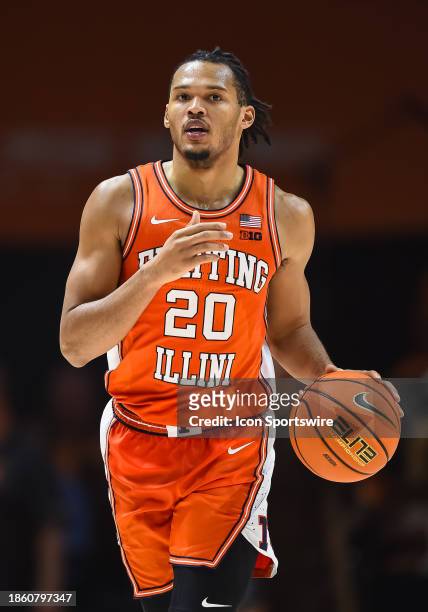 Illinois Fighting Illini forward Ty Rodgers brings the ball up court during the college basketball game between the Tennessee Volunteers and the...
