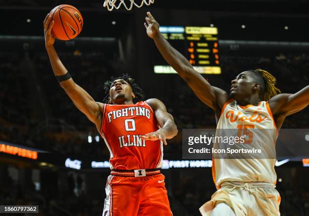 Illinois Fighting Illini guard Terrence Shannon Jr. Drives past Tennessee Volunteers guard Jahmai Mashack for a shot during the college basketball...