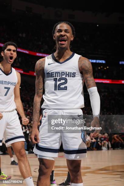 Ja Morant of the Memphis Grizzlies celebrates after scoring the game winning basket against the New Orleans Pelicans on December 19, 2023 at the...