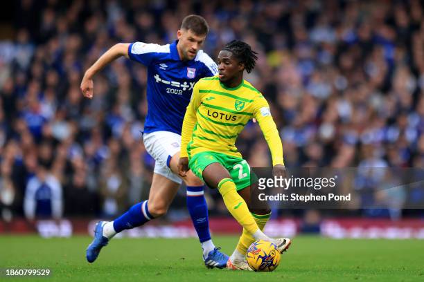 Cameron Burgess of Ipswich Town and Jonathan Rowe of Norwich City compete for the ball during the Sky Bet Championship match between Ipswich Town and...
