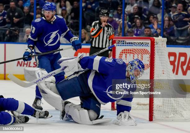 Tampa Bay Lightning goaltender Andrei Vasilevskiy traps the loose puck during the NHL Hockey match between the Tampa Bay Lightning and St Louis Blues...