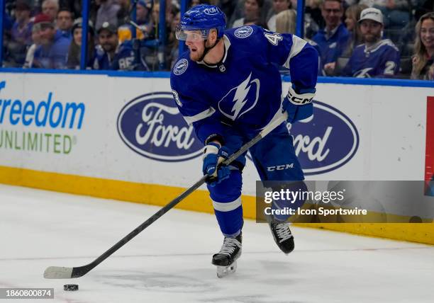 Tampa Bay Lightning defenseman Darren Raddysh looks to pass the puck during the NHL Hockey match between the Tampa Bay Lightning and St Louis Blues...