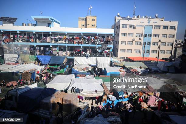 Displaced Palestinians are taking shelter in a UNRWA-affiliated Deir al-Balah school after fleeing their homes due to Israeli strikes, amid the...