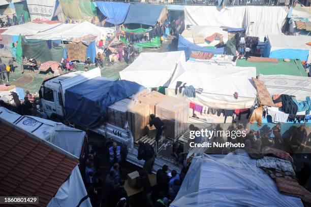 Displaced Palestinians are taking shelter in a UNRWA-affiliated Deir al-Balah school after fleeing their homes due to Israeli strikes, amid the...