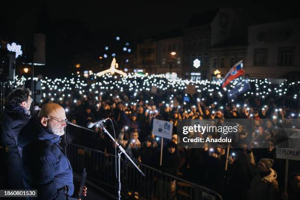 Opposition demonstrators protest against the cancellation of the special prosecutor's office as they hold banners and flags in front of the...