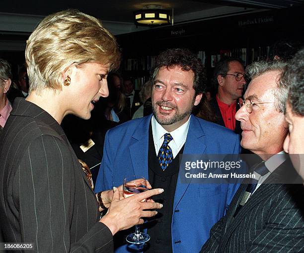 Diana, The Princess of Wales talks to TV presenter Jeremy Beadle and photographer to the stars Terry O'Neill, at Harrods book department, where she...