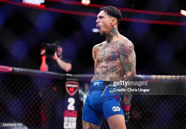 Andre Fili reacts to his win in a featherweight fight during the UFC 296 event at T-Mobile Arena on December 16, 2023 in Las Vegas, Nevada.