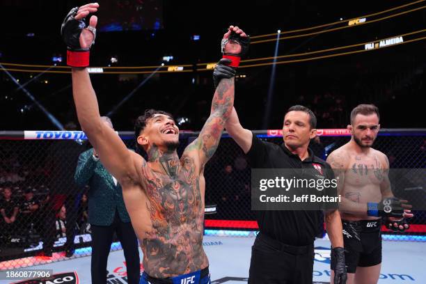 Andre Fili reacts to his win in a featherweight fight during the UFC 296 event at T-Mobile Arena on December 16, 2023 in Las Vegas, Nevada.