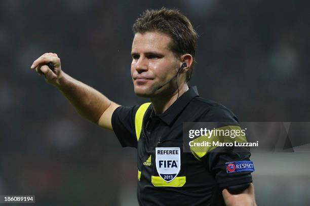 Referee Felix Brych looks on during the UEFA Champions League Group H match between AC Milan and FC Barcelona at Stadio Giuseppe Meazza on October...