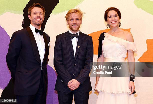 Prince Frederik of Denmark and Princess Mary of Denmark pose with violinist Rune Tonsgaard Sorensen , joint winner of the Rising Star Award at the...