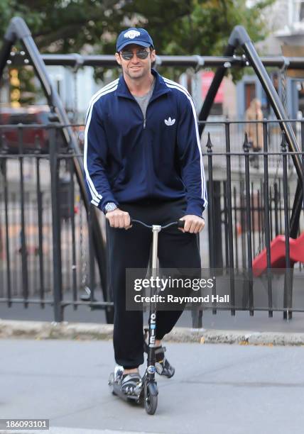 Actor Hugh Jackman is seen on is scooter in Soho on October 28, 2013 in New York City.