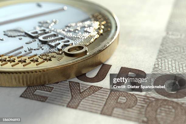 euro coin on euro note - european union coin stock illustrations