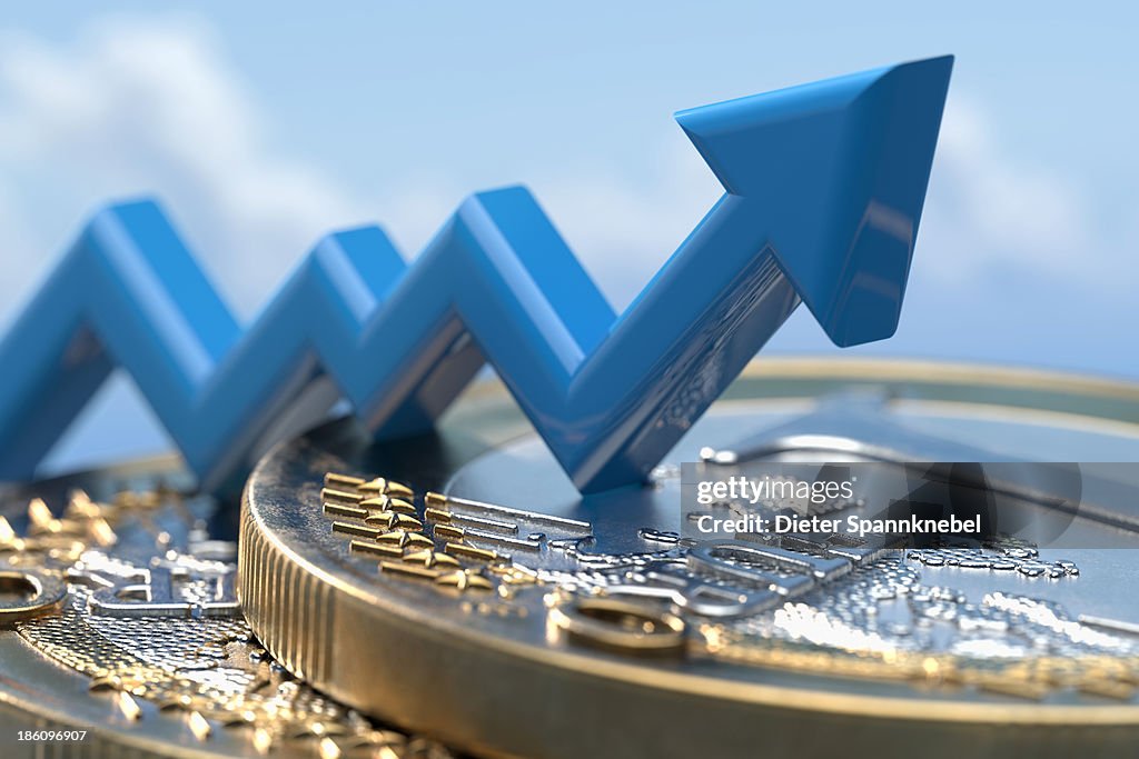 Up arrow on a stack of euro coins