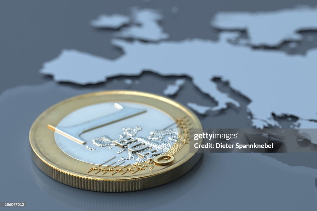 Euro coin on a map of Europe