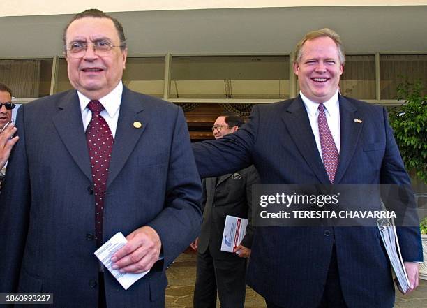 Costa Rican President Abel Pacheco is accompanied by Grant Aldonas, Undersecretary of Commerce for the United States, after signing a joint...
