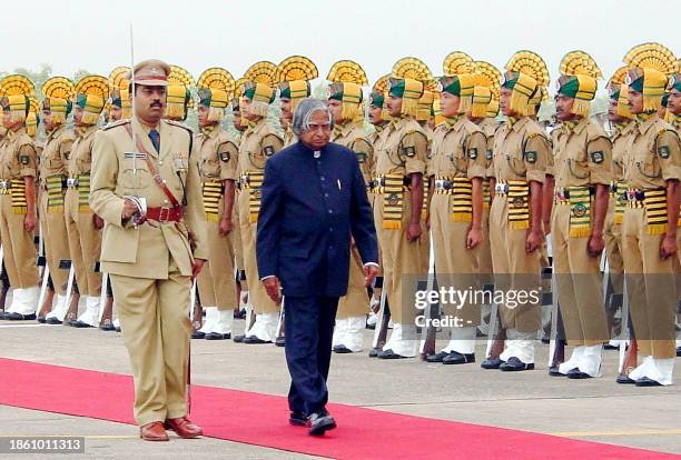 Indian President A.P.J. Abdul Kalam inspects a guard of honour upon arrival at the airport, 04 October 2002, in Agartala, capital of Tripura state in...