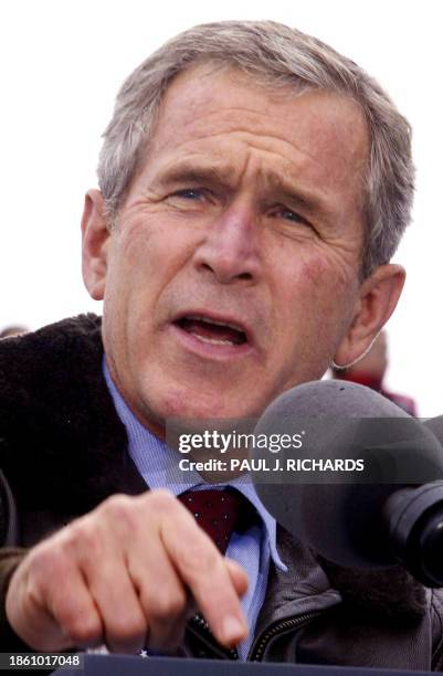 President George W. Bush addresses a campaign rally 27 September 2002 at the Coconino County Fairgrounds in Flagstaff, Arizona. Bush, on a Republican...