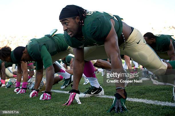Lache Seastrunk of the Baylor Bears stretches before kickoff against the Iowa State Cyclones on October 19, 2013 at Floyd Casey Stadium in Waco,...