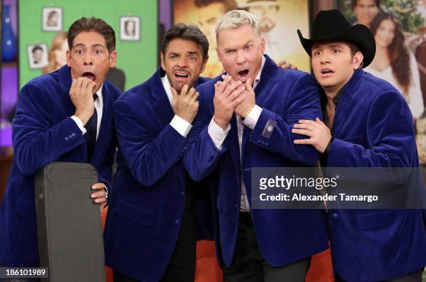 Johnny Lozada, Eugenio Derbez, Sam Champion and El Dasa are seen on the set of Despierta America for simulcast with "Good Morning America" and...