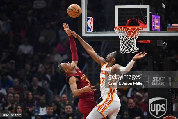 Isaac Okoro of the Cleveland Cavaliers shoots over Onyeka Okongwu of the Atlanta Hawks during the second quarter at Rocket Mortgage Fieldhouse on...