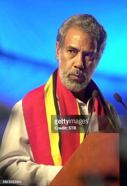 East Timorese President Xanana Gusmao, wearing a cloth with the new national colors, gives his inaugural address shortly after midnight declaring...