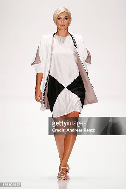 Model walks the runway at the Julia Dalakian show during Mercedes-Benz Fashion Week Russia S/S 2014 on October 28, 2013 in Moscow, Russia.