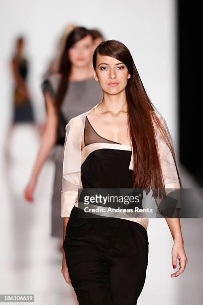 Models walk the runway at the Julia Dalakian show during Mercedes-Benz Fashion Week Russia S/S 2014 on October 28, 2013 in Moscow, Russia.