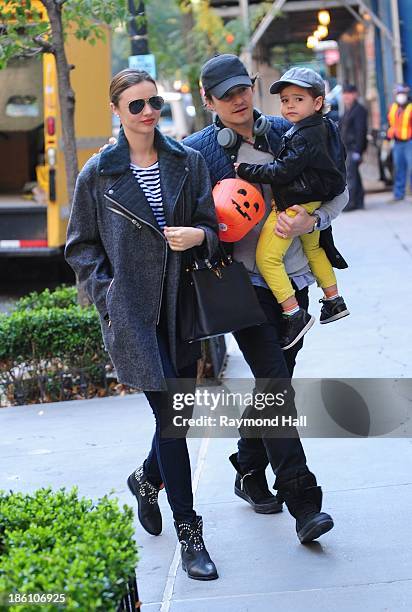 Model Miranda Kerr and Orlando Bloom with baby Flynn are seen together on Upper East Side in NYC on October 28, 2013 in New York City.