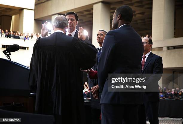 Director James Comey participates in a ceremonial swearing-in, officiated by Judge John Walker , U.S. President Barack Obama , Deputy FBI Director...