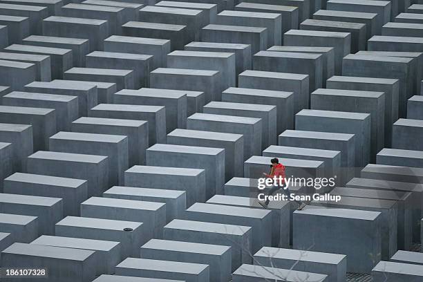 Boy hops from one to another of the 2,711 stellae at the Memorial to the Murdered Jews of Europe, also called the Holocaust Memorial, on October 28,...