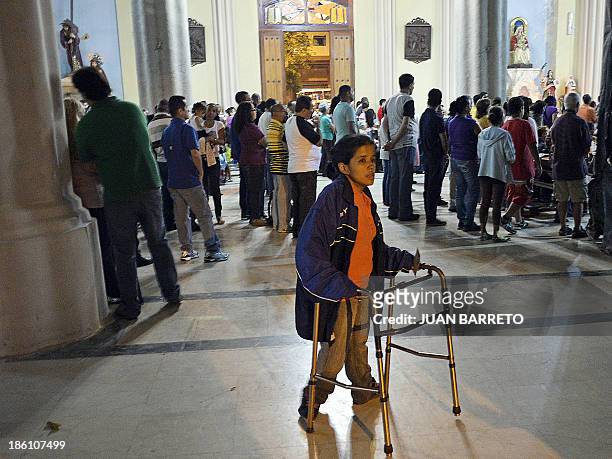 Sofia Miselem People attend mass at the Holy Church of La Candelaria where the remains of doctor Jose Gregorio Hernandez are kept, in downtown...