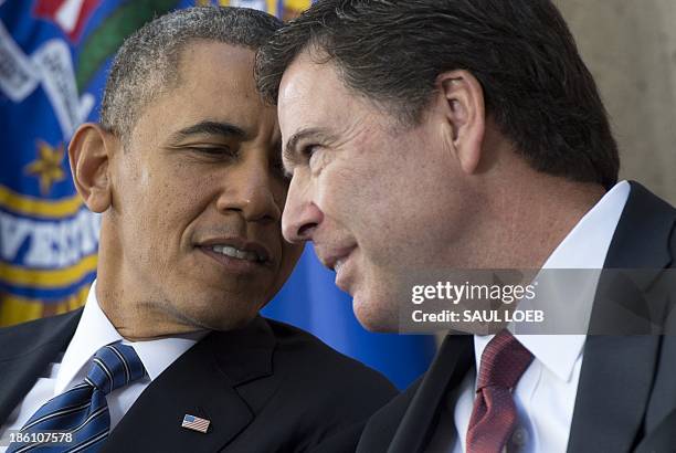 President Barack Obama speaks with new FBI Director James Comey during an installation ceremony at Federal Bureau of Investigation Headquarters in...