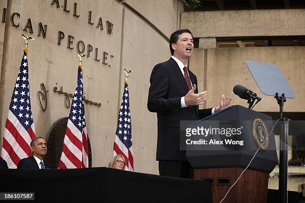 Director James Comey speaks during a ceremonial swearing-in ceremony as his wife Patrice , U.S. President Barack Obama look on at the FBI...