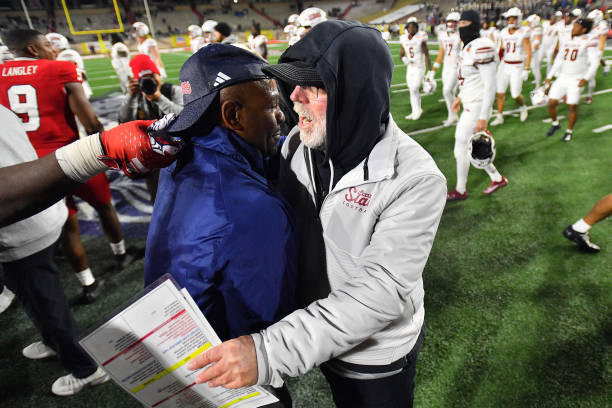 Interim head coach Tim Skipper of the Fresno State Bulldogs and head coach Jerry Kill of the New Mexico State Aggies talk after the Isleta New Mexico...