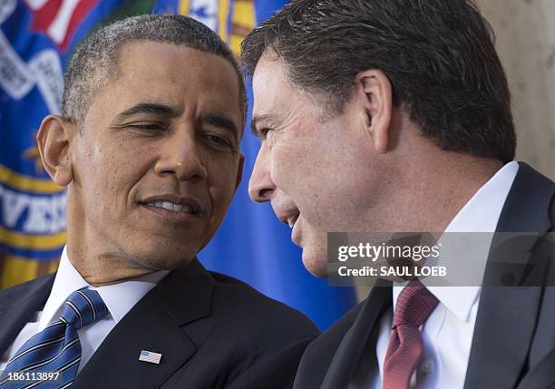 President Barack Obama speaks with new FBI Director James Comey during an installation ceremony at Federal Bureau of Investigation Headquarters in...