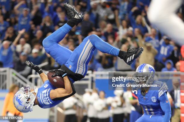 Amon-Ra St. Brown of the Detroit Lions celebrates after scoring a touchdown during the second quarter against the Denver Broncos at Ford Field on...