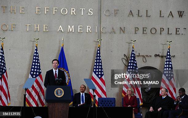 President Barack Obama listens as new Federal Bureau of Investigation director James Comey speaks during his installation ceremony at the FBI...