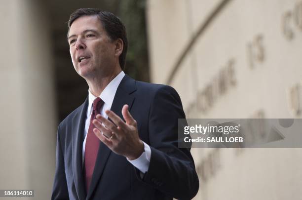 New FBI Director James Comey speaks during his installation ceremony at Federal Bureau of Investigation Headquarters in Washington on October 28,...