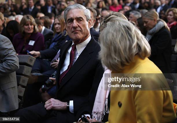 Former FBI director Robert Mueller attends the ceremonial swearing-in of FBI Director James Comey at the FBI Headquarters October 28, 2013 in...