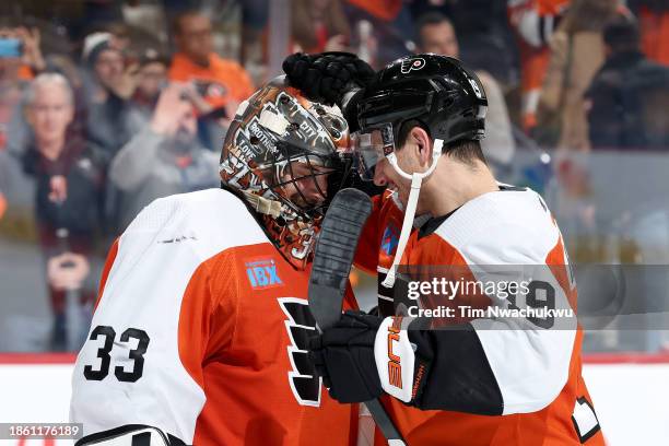 Samuel Ersson and Garnet Hathaway of the Philadelphia Flyers react after defeating the Detroit Red Wingsat the Wells Fargo Center on December 16,...