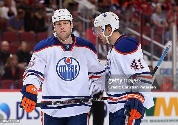 Ben Eager and Will Acton of the Edmonton Oilers during the NHL game against the Phoenix Coyotes at Jobing.com Arena on October 26, 2013 in Glendale,...