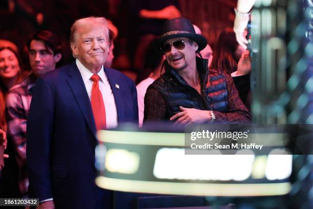 Republican presidential candidate and former U.S. President Donald Trump smiles alongside Kid Rock as they attend the UFC 296: Edwards vs. Covington...