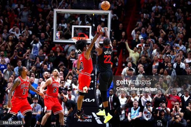 Jimmy Butler of the Miami Heat shoots the game winning basket to defeat the Chicago Bulls during the fourth quarter of the game at Kaseya Center on...