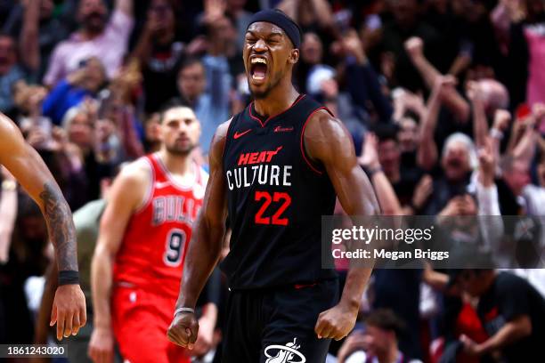 Jimmy Butler of the Miami Heat reacts after making a game winning basket against the Chicago Bulls at Kaseya Center on December 16, 2023 in Miami,...