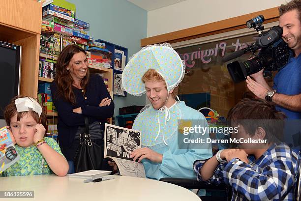 Boston Bruins Dougie Hamilton celebrates Halloween with Brendan and Juan at Boston Children's Hospital on October 28, 2013 in Boston, Massachusetts.