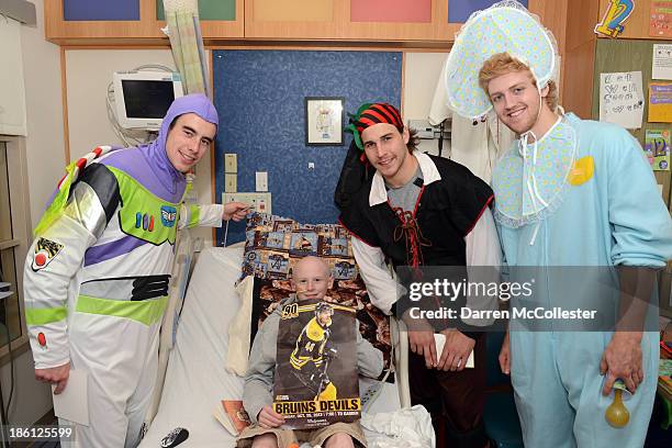 Reilly Smith, Matt Bartkowski, and Dougie Hamilton of the Boston Bruins celebrate Halloween with Owen at Boston Children's Hospital on October 28,...