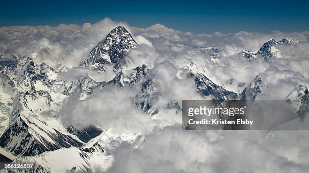 The second highest mountain in the world with a peak elevation of 8,611 m , is viewed from a Boeing 737 aircraft during an air safari.