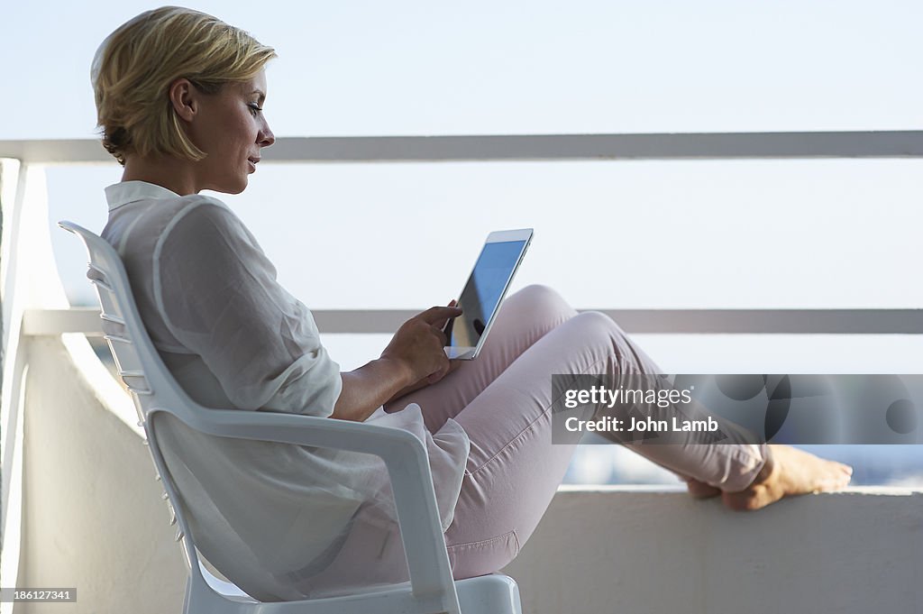 Woman using tablet computer