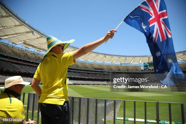 Aussie Fan waves the Australian flag during day four of the Men's First Test match between Australia and Pakistan at Optus Stadium on December 17,...